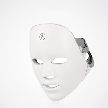White LED face mask on a light gray background
