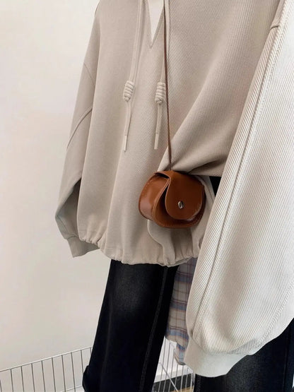 Large size fake two-piece hatless short sweatshirt for women in early autumn 2025 new loose and chic slim long-sleeved top