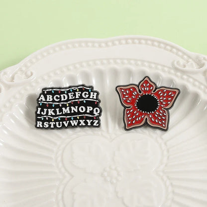 Sci-fi Horror Movies Brooch Enamel Pins Red Cannibal Flowers And 26 English Letter Brooches Backpack Lapel Badge Jewelry Gifts